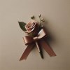 Indulge in the luxurious elegance of our Chocolate Decadence Wrist Corsage and