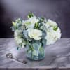 This refined white-on-white floral design features a soothing blend of white hydrangea