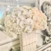 This luxurious all-white design features a harmonious blend of white hydrangea, ivory