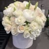 This elegant round arrangement features a pristine mix of ivory and white