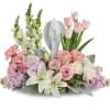 Show them you care with this gorgeous display of roses, lilies and