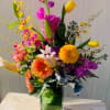 Airy design with  high end flowers including orchids and snaps and