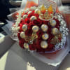 An elegant floral arrangement featuring delicate baby&rsquo;s breath, and 50 exquisite roses