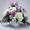 Soft and gentle flower basket in hues of pink, lavender, and white.