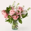 Pink roses, carnations and White stock flowers. A traditional selection in a