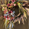 This beautiful faux wreath will brighten up your entryway this fall! 