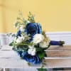 Handheld white and dark blue prom bouquet with mixed flowers.
Actual Bouquets will