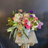 Beautiful arrangement in a antique styled urn. 