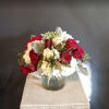 Medium sized arrangement with premium roses, garden roses, and other flowers 