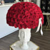 A true masterpiece: deep red roses in full bloom, their velvety petals