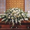 All White Casket Spray with carnations, gerbera daisies, gladiolas, monte cassino asters