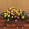 Casket spray with gerbera daisies, roses and carnations