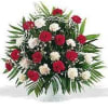 Funeral spray with red and white carnations, filler and greenery
