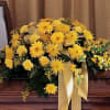 Casket spray in all yellow carnations, fuji mums, gerbera daisies, snapdragons and