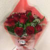 12 red roses wrapped in a hand-hold bouquet with babies&#039; breathe and