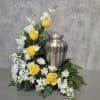 This arrangement has roses, stock, mums and greenery. Urn not included. 