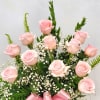 Show how much you care with a dozen delicate pink roses, artfully