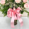 Show how much you care with a dozen delicate pink roses, artfully