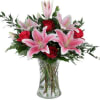Our original Two Hearts arrangement showcases beautiful red roses and stargazer lilies
