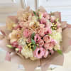 Signature hand-tied bouquet 
Hydrangeas 
Roses 
Orchids 
Coffee beans 
Lisianthus 

*This bouquet does