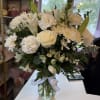 Medium vase with different kind of white flowers, greenery , roses, carnations