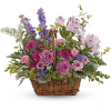 This lush lavender rose arrangement is a basket of beauty to brighten