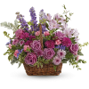 This lush lavender rose arrangement is a basket of beauty to brighten