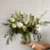 This arrangement is uniquely crafted with our love for white peonies and