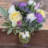 Beautiful spring bouquet filled with roses, tulips, ranunculus and carnations. 
