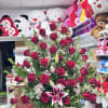 Red roses and baby breath plus greenery 