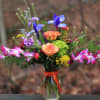Beautifully unique arrangement of spring and tropical favorites. Gorgeous orchids with fragrant