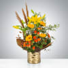 Autumn glimmer is a quintessential fall arrangement featuring a gold architecture vase