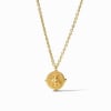 A faceted gemstone enhanced with four golden beads, dangling from a delicate