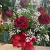 Six fresh red roses with baby breath , leather 