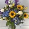Sunflowers bursting with color in this beautiful arrangement! 