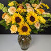 Embrace the cheerful radiance of our Sunny Sunflower Delight. This vibrant arrangement