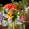 A colorful and fresh arrangement with bright and bold Dahlias. 
