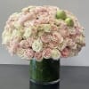 A perfect blend of blush pink and ivory roses in classic round