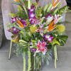 Like a tropical island breeze this eye catching arrangement will capture that