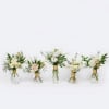 A classic yet modern set of glass bud vases with a brass