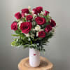 A timeless and romantic favorite, this elegant arrangement showcases 18 premium Sherwood