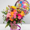 The blossoming birthday boquet features roses, stock flower, snapdragons, poms, delphinium, alstrometria