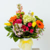 This bright and vibrant arrangement is sure do make them smile. 