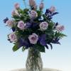 An enchanting bouquet of lavender roses sweetly touches her heart.  The