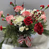 This holiday bouquet is sure to begin the celebrations with its lovely
