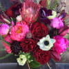 This amazing floral piece of art incorporates the most stunning flowers of
