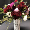 This amazing floral piece of art incorporates the most stunning flowers of