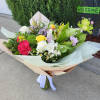Designer&#039;s Choice Wrap Bouquet in vibrant colors in season florals. Ready to