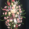 Standing spray pink and white 
stargazer lilies, snap dragons, roses, spray roses
