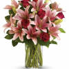 This magically enchanting bouquet of roses and lilies will sure to make